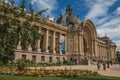 People and garden in front the Petit PalaisÃ¢â¬â¢s facade in Paris.